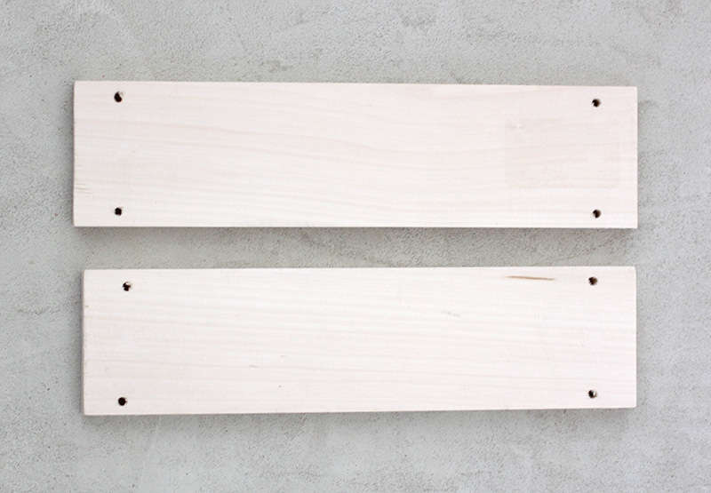 drilled holes in wood pieces for shelves